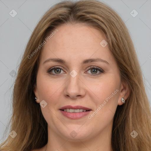 Joyful white adult female with long  brown hair and brown eyes