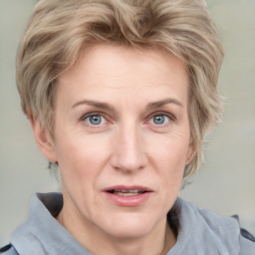 Joyful white adult female with medium  brown hair and blue eyes