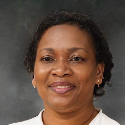 Joyful black adult female with short  brown hair and brown eyes