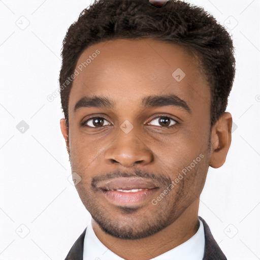 Joyful black young-adult male with short  black hair and brown eyes