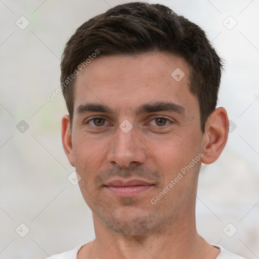 Joyful white young-adult male with short  brown hair and brown eyes