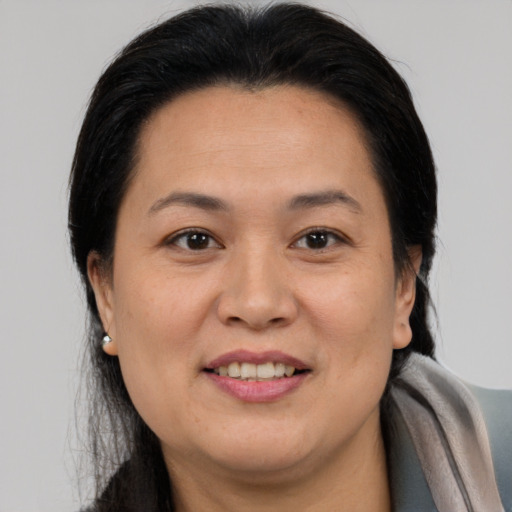 Joyful white adult female with medium  brown hair and brown eyes
