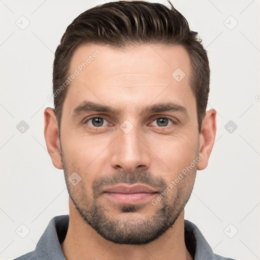 Joyful white adult male with short  brown hair and brown eyes