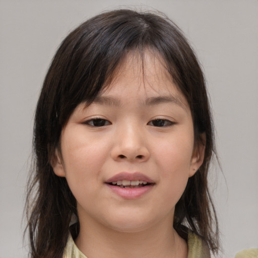 Joyful asian child female with medium  brown hair and brown eyes