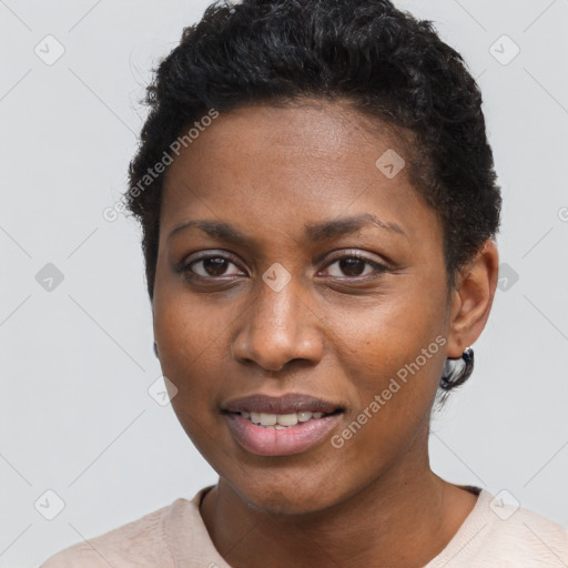 Joyful black young-adult female with short  brown hair and brown eyes