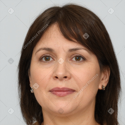 Joyful white adult female with medium  brown hair and brown eyes