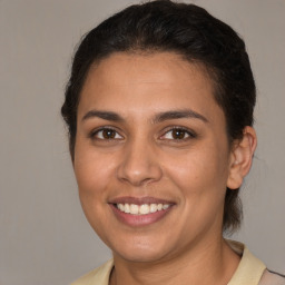 Joyful white young-adult female with medium  brown hair and brown eyes