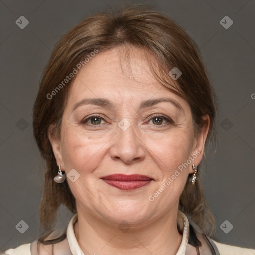 Joyful white adult female with medium  brown hair and brown eyes