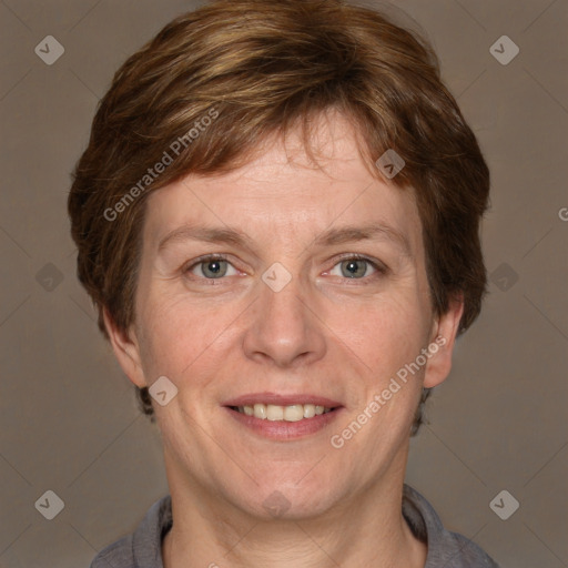 Joyful white adult female with short  brown hair and grey eyes