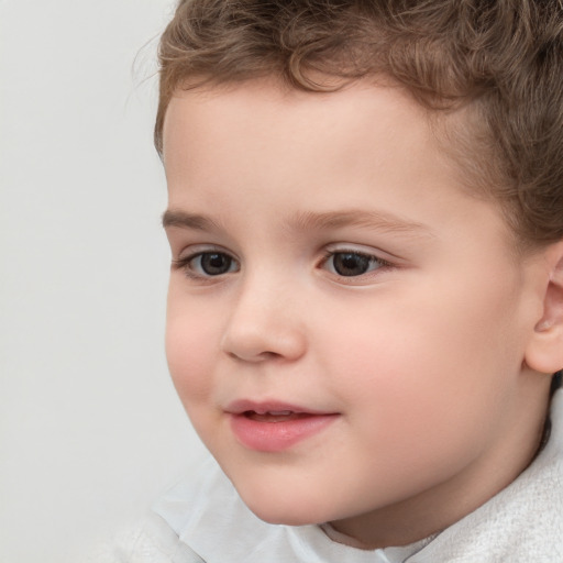 Joyful white child male with short  brown hair and brown eyes