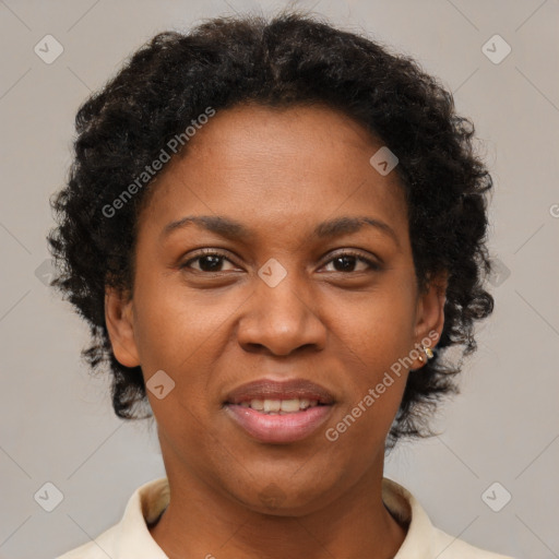 Joyful black adult female with short  brown hair and brown eyes