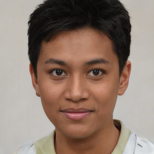 Joyful asian young-adult male with short  black hair and brown eyes