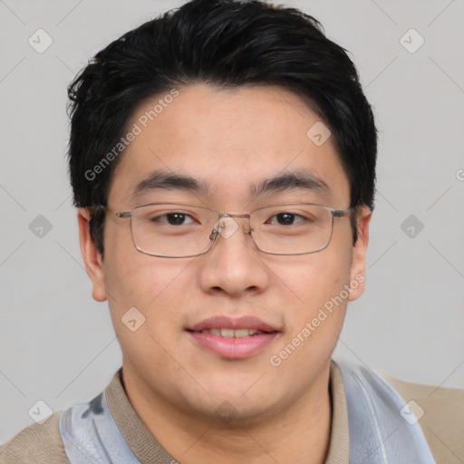 Joyful asian young-adult male with short  black hair and brown eyes