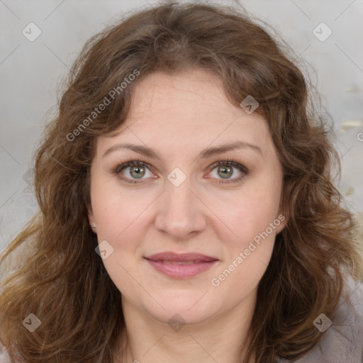 Joyful white adult female with medium  brown hair and green eyes