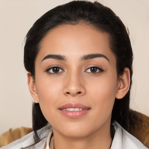 Joyful white young-adult female with medium  black hair and brown eyes