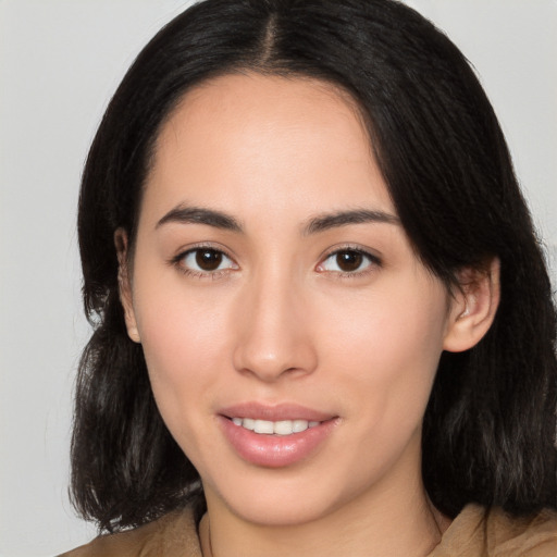 Joyful white young-adult female with medium  black hair and brown eyes