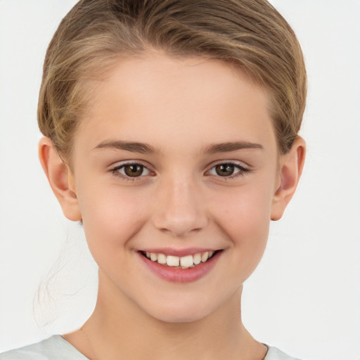 Joyful white child female with short  brown hair and brown eyes