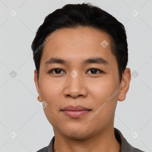 Joyful latino young-adult male with short  black hair and brown eyes