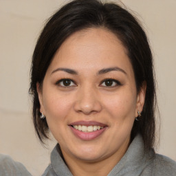 Joyful white adult female with medium  brown hair and brown eyes