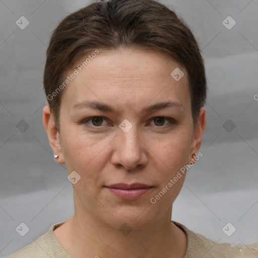 Joyful white adult female with short  brown hair and grey eyes