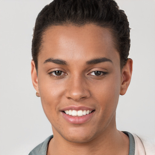 Joyful white young-adult female with short  brown hair and brown eyes