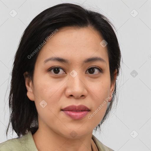 Joyful latino young-adult female with medium  brown hair and brown eyes