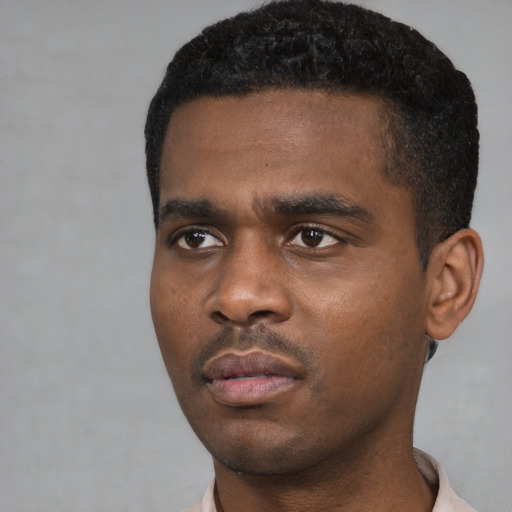 Neutral black young-adult male with short  black hair and brown eyes