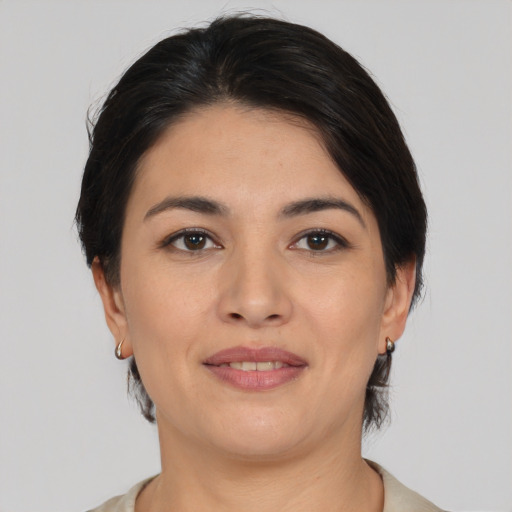 Joyful asian young-adult female with medium  brown hair and brown eyes