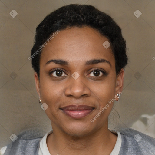 Joyful black young-adult female with short  black hair and brown eyes