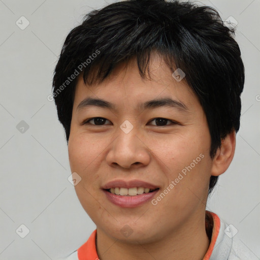 Joyful asian young-adult male with short  brown hair and brown eyes