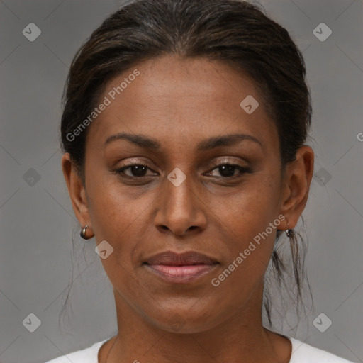 Joyful black young-adult female with medium  brown hair and brown eyes