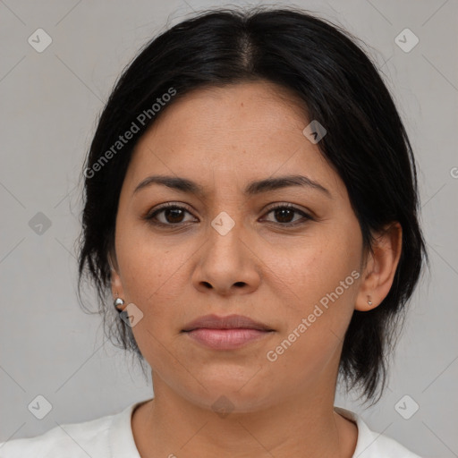 Joyful asian adult female with medium  brown hair and brown eyes