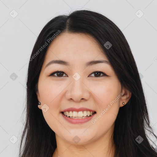 Joyful asian young-adult female with long  brown hair and brown eyes