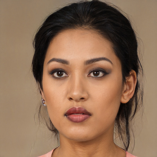 Neutral latino young-adult female with long  brown hair and brown eyes
