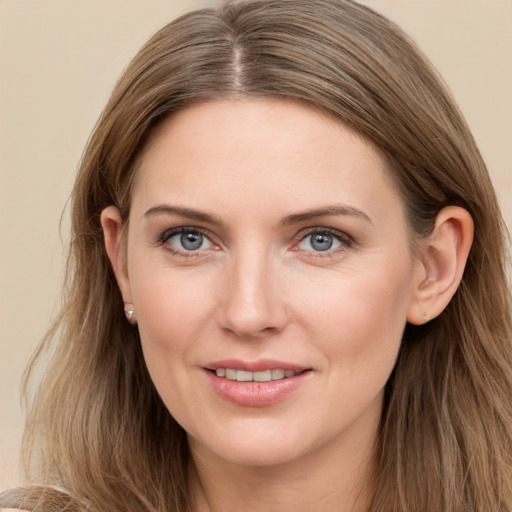 Joyful white young-adult female with long  brown hair and grey eyes