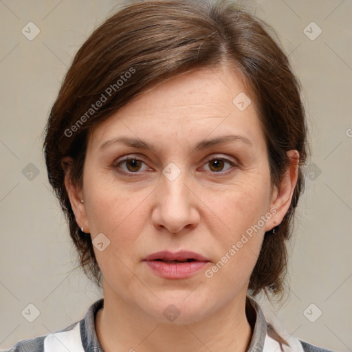 Joyful white adult female with medium  brown hair and grey eyes