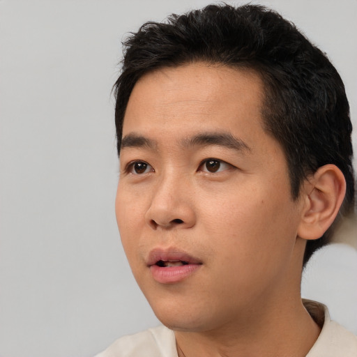 Neutral asian young-adult male with short  black hair and brown eyes