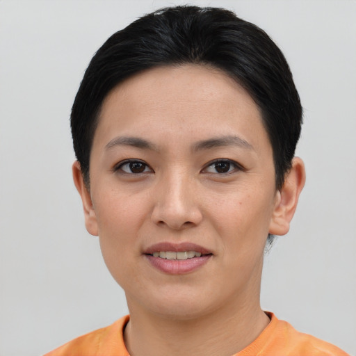 Joyful asian young-adult female with short  black hair and brown eyes