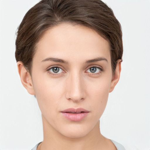 Neutral white young-adult female with short  brown hair and brown eyes