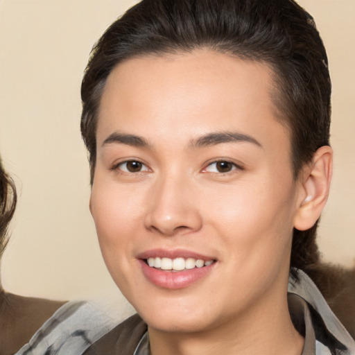 Joyful white young-adult female with medium  brown hair and brown eyes