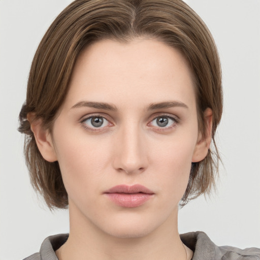 Neutral white young-adult female with medium  brown hair and grey eyes