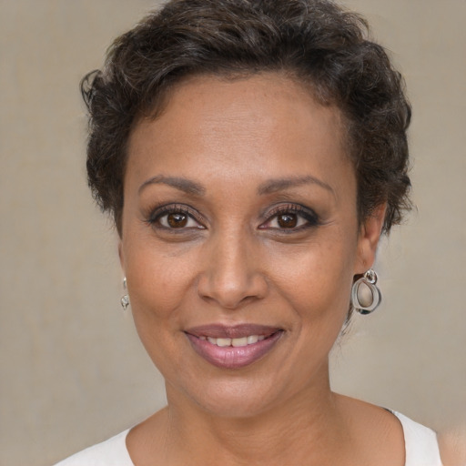 Joyful white adult female with short  brown hair and brown eyes