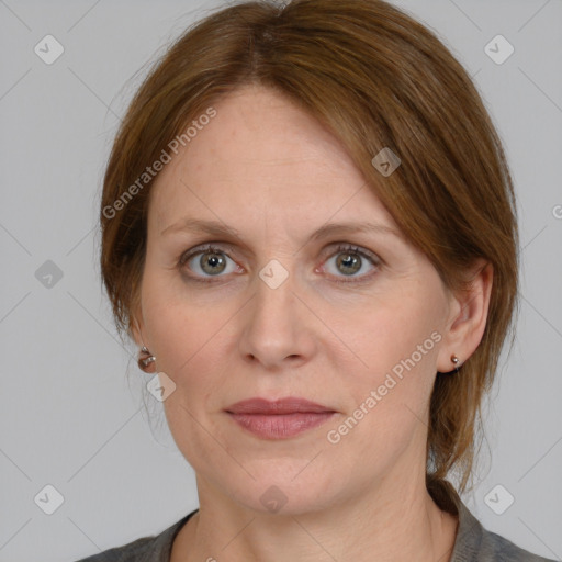 Joyful white adult female with medium  brown hair and grey eyes