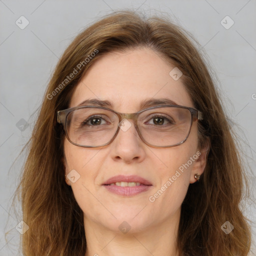 Joyful white adult female with long  brown hair and brown eyes