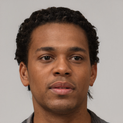 Neutral black young-adult male with short  brown hair and brown eyes