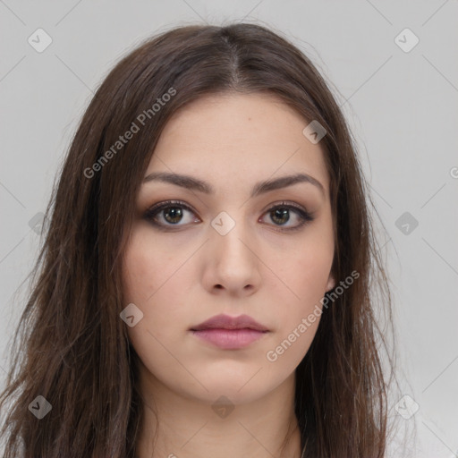 Neutral white young-adult female with long  brown hair and brown eyes