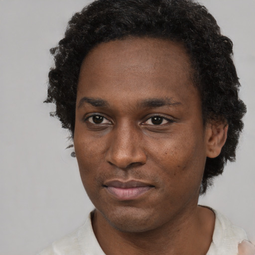 Neutral black young-adult male with short  brown hair and brown eyes
