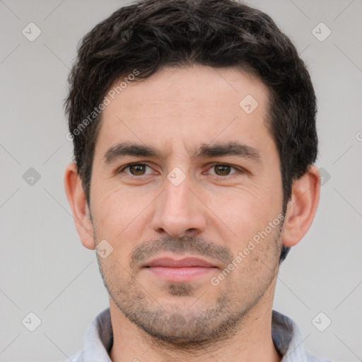 Joyful white young-adult male with short  black hair and brown eyes