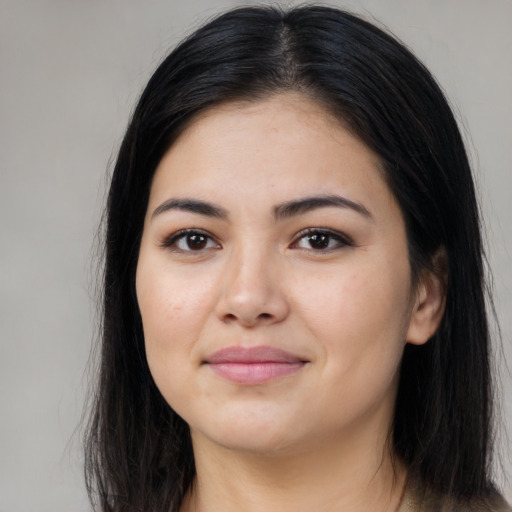Joyful asian young-adult female with long  black hair and brown eyes