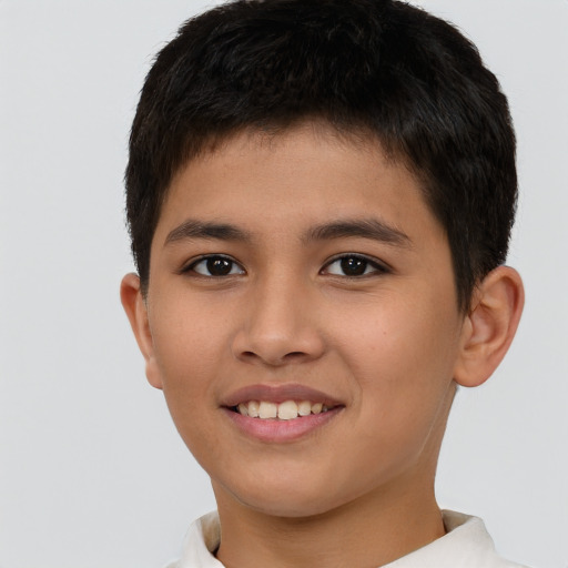 Joyful white child male with short  brown hair and brown eyes